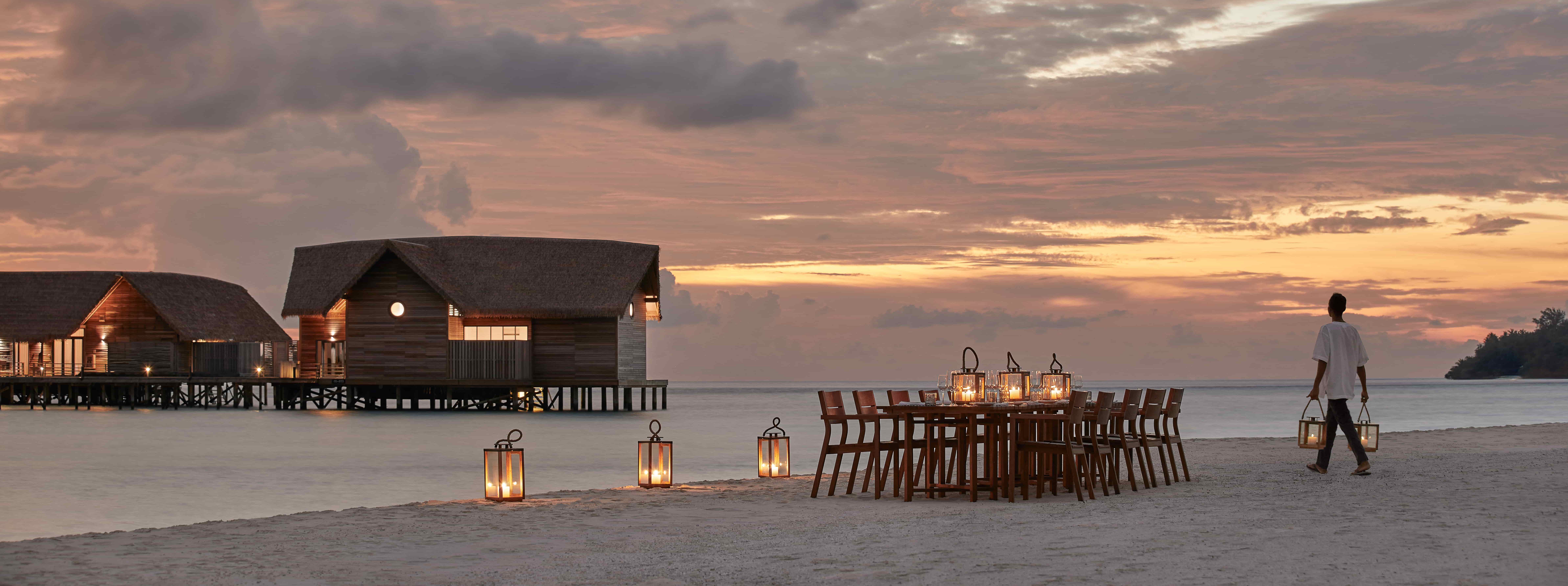 Beach dining at sunset, COMO Cocoa Island, Maldives